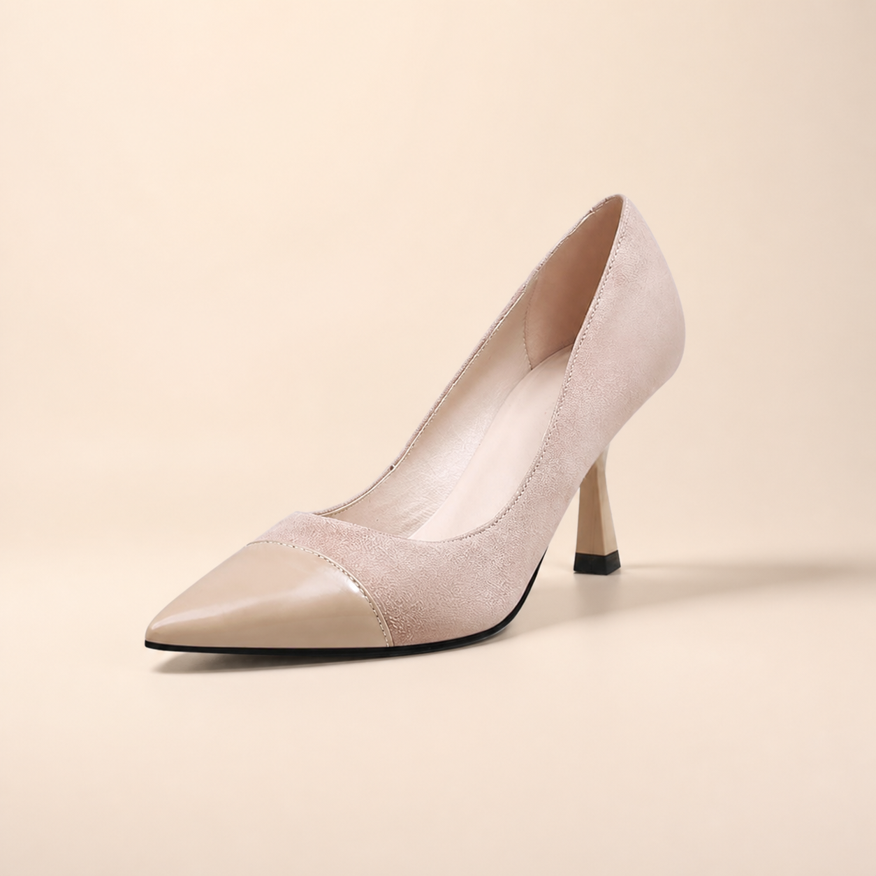 Apricot two-tone pointed-toe pump with glossy toe cap and sculpted flared heel