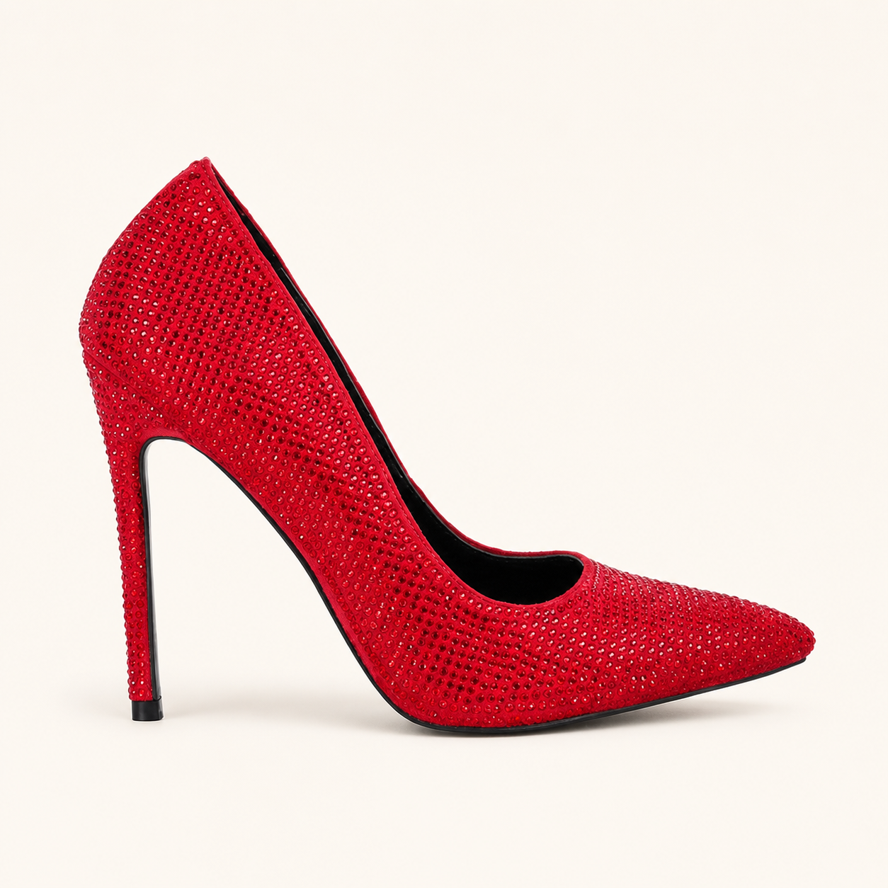Red diamante pointed-toe stiletto court heel on a warm ivory background