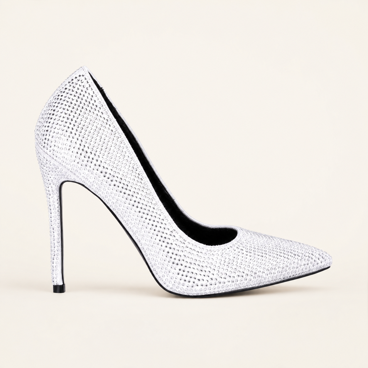 White diamante pointed-toe stiletto court heel on a warm ivory background